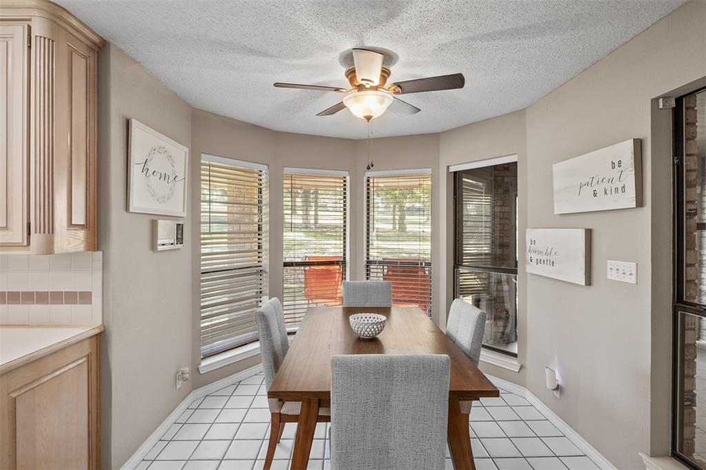 8919 Bontura Road Granbury, TX 76049 - Photo 13 of 35 a view of a dining room with furniture window and outside view