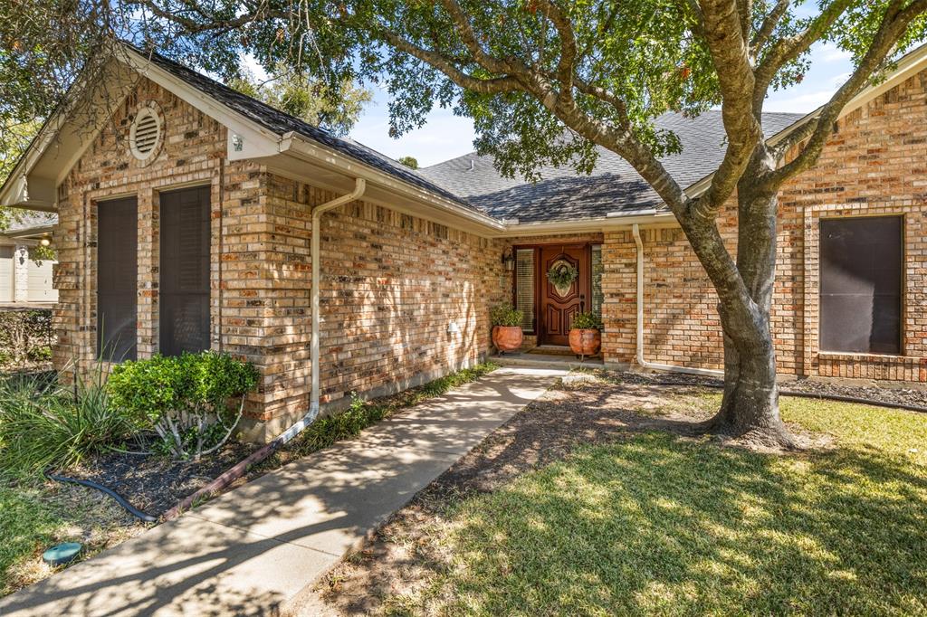 8919 Bontura Road Granbury, TX 76049 - Photo 2 of 35 a view of a house with a tree in the yard