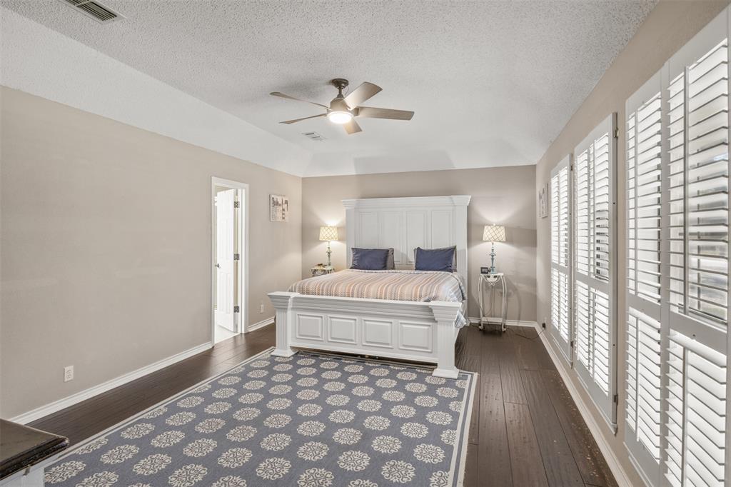 8919 Bontura Road Granbury, TX 76049 - Photo 22 of 35 a bedroom with a large bed and a window