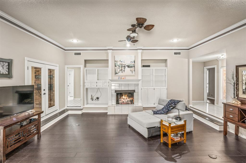 8919 Bontura Road Granbury, TX 76049 - Photo 7 of 35 a living room with furniture and a fireplace
