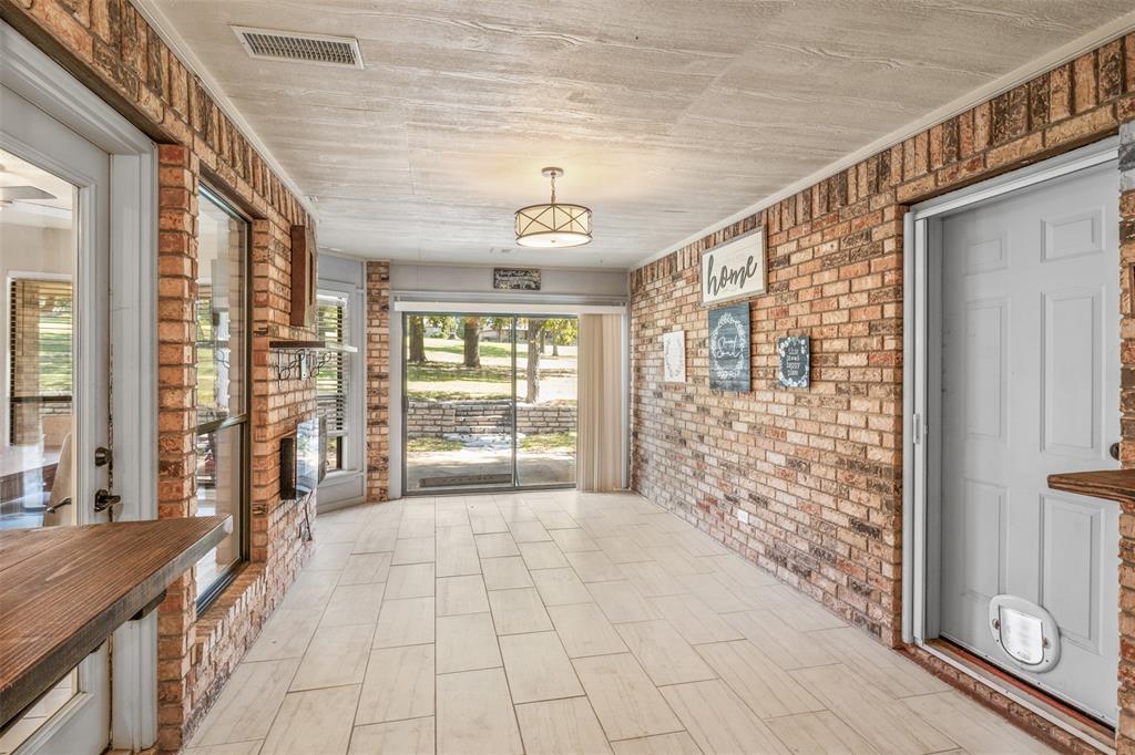 8919 Bontura Road Granbury, TX 76049 - Photo 10 of 35 a view of a hallway with windows