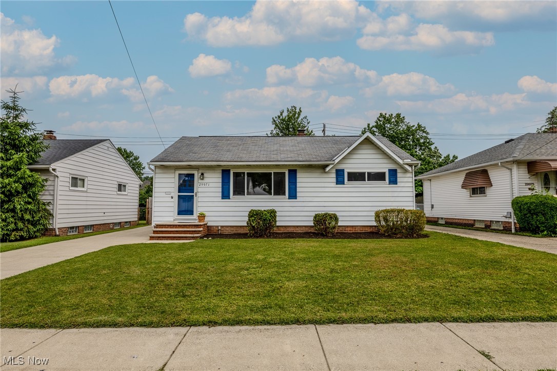 29971 Regent Road Wickliffe, OH 44092 - Photo 1 of 39 View of front facade featuring a front lawn and a shingled roof