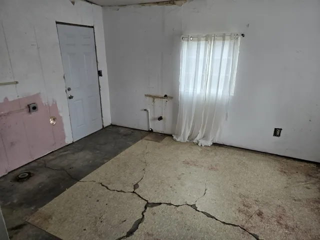 an empty room with windows