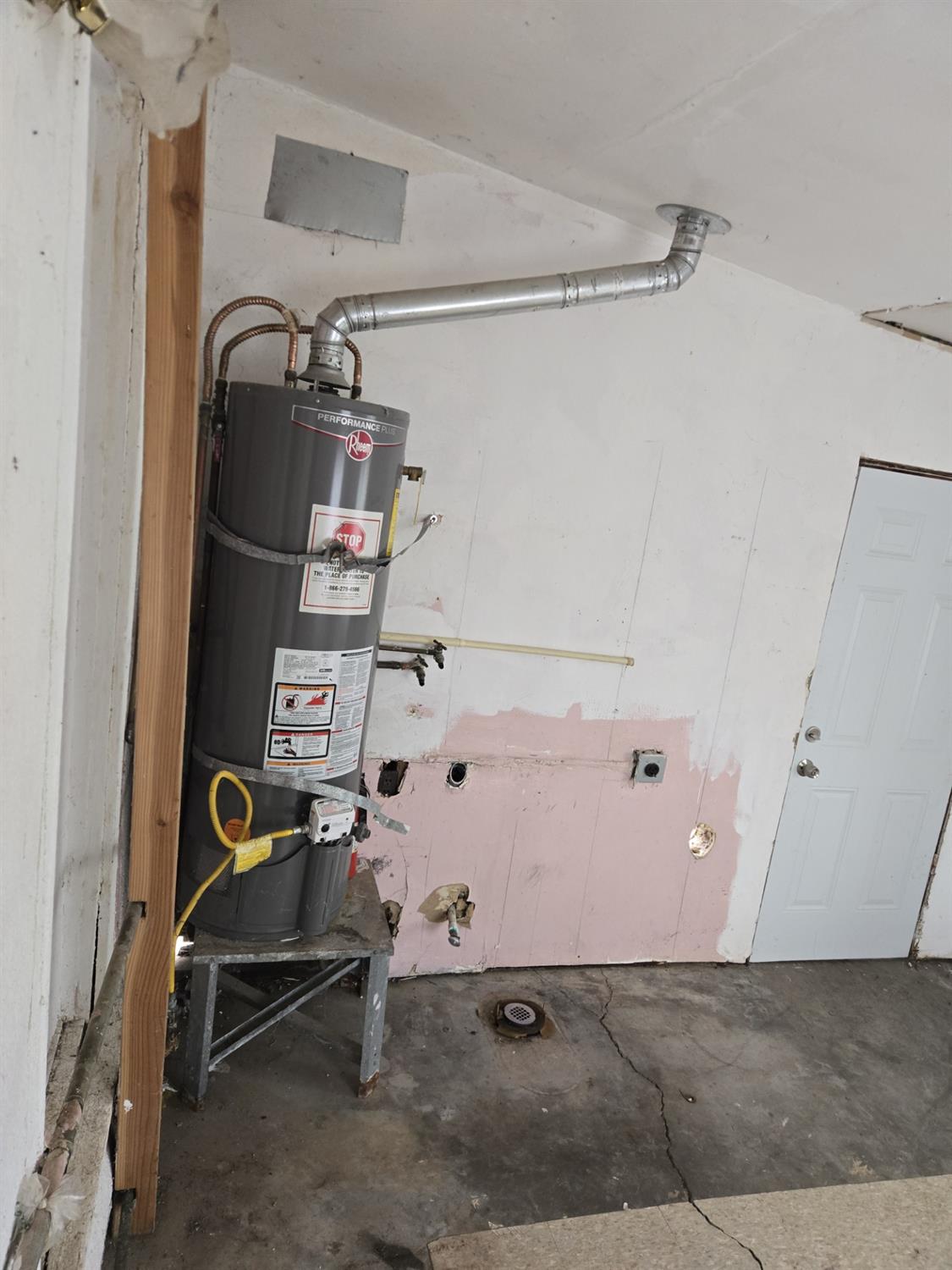 1726 Merced Street Dos Palos, CA 93620 - Photo 12 of 12 a view of storage and utility room with racks on the wall