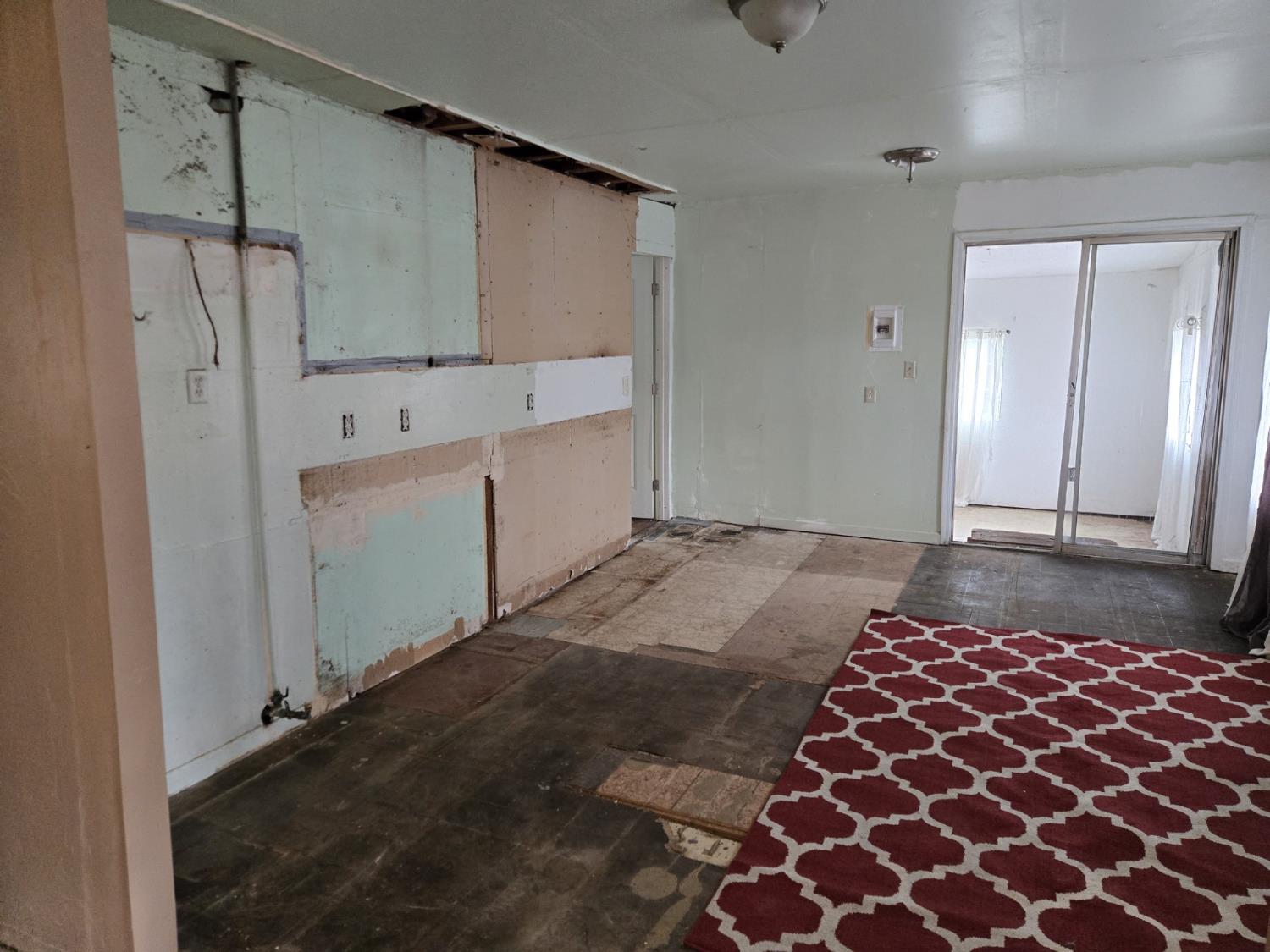 1726 Merced Street Dos Palos, CA 93620 - Photo 4 of 12 a bedroom with a bed and a cabinets