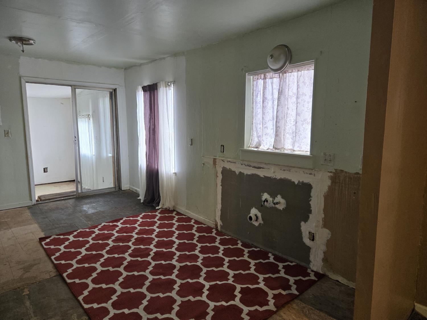 1726 Merced Street Dos Palos, CA 93620 - Photo 5 of 12 a bathroom with a bathtub and shower