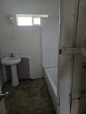 a bathroom with a sink and shower