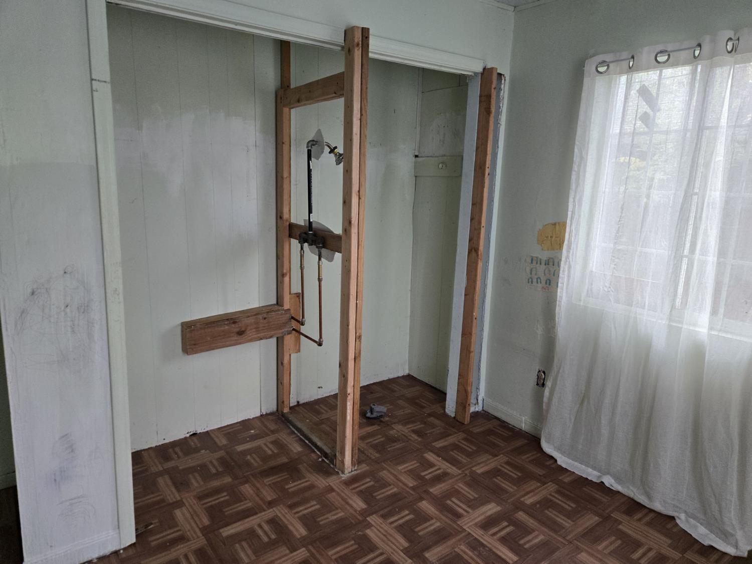 1726 Merced Street Dos Palos, CA 93620 - Photo 9 of 12 a bathroom with a shower and a sink