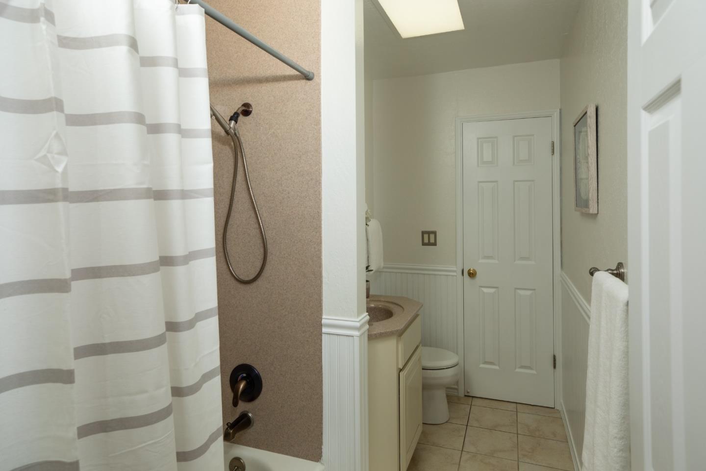 2545 Austin Place Santa Clara, CA 95050 - Photo 16 of 21 a bathroom with a granite countertop shower and a toilet