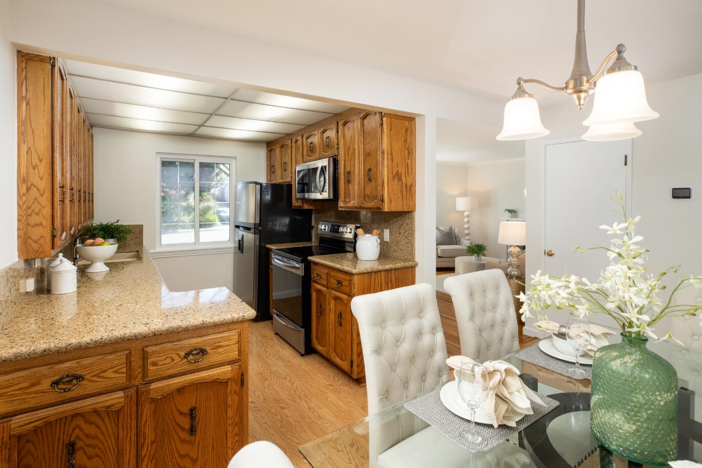 2545 Austin Place Santa Clara, CA 95050 - Photo 5 of 21 a kitchen with stainless steel appliances kitchen island granite countertop a sink and cabinets