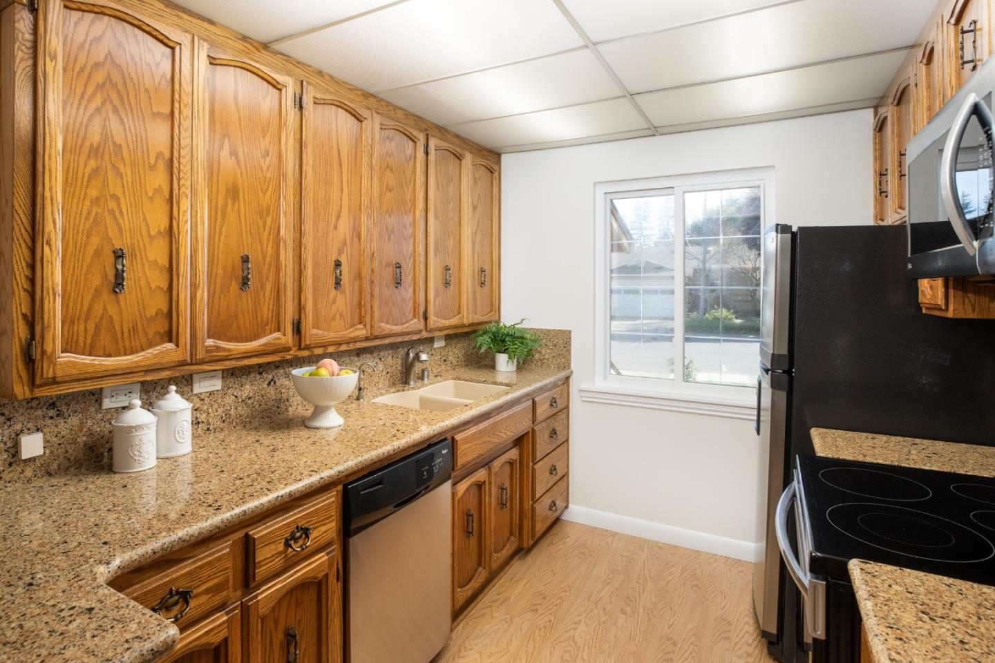 2545 Austin Place Santa Clara, CA 95050 - Photo 6 of 21 a bathroom with a granite countertop sink and a mirror