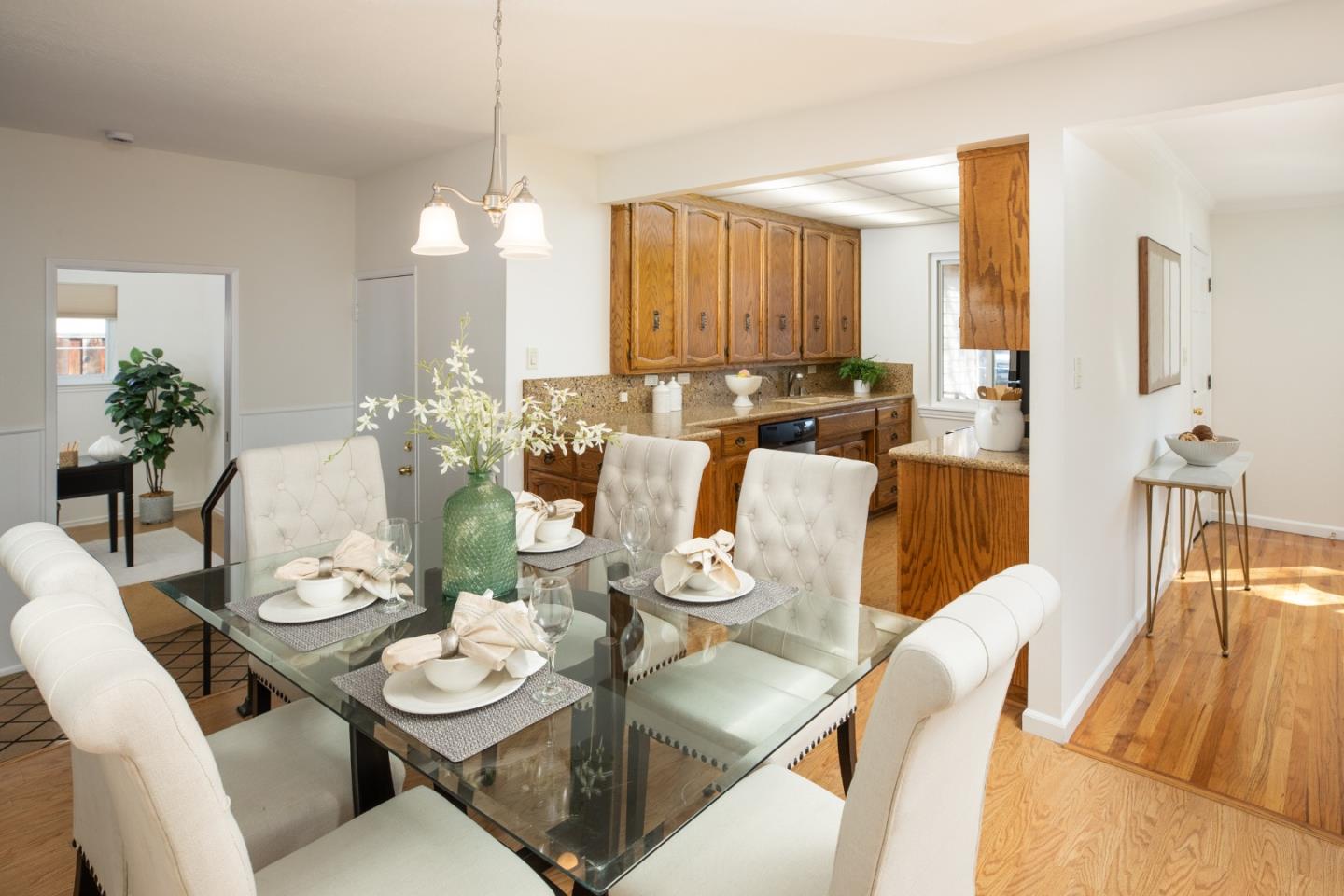 2545 Austin Place Santa Clara, CA 95050 - Photo 7 of 21 a dining room with furniture a chandelier and wooden floor