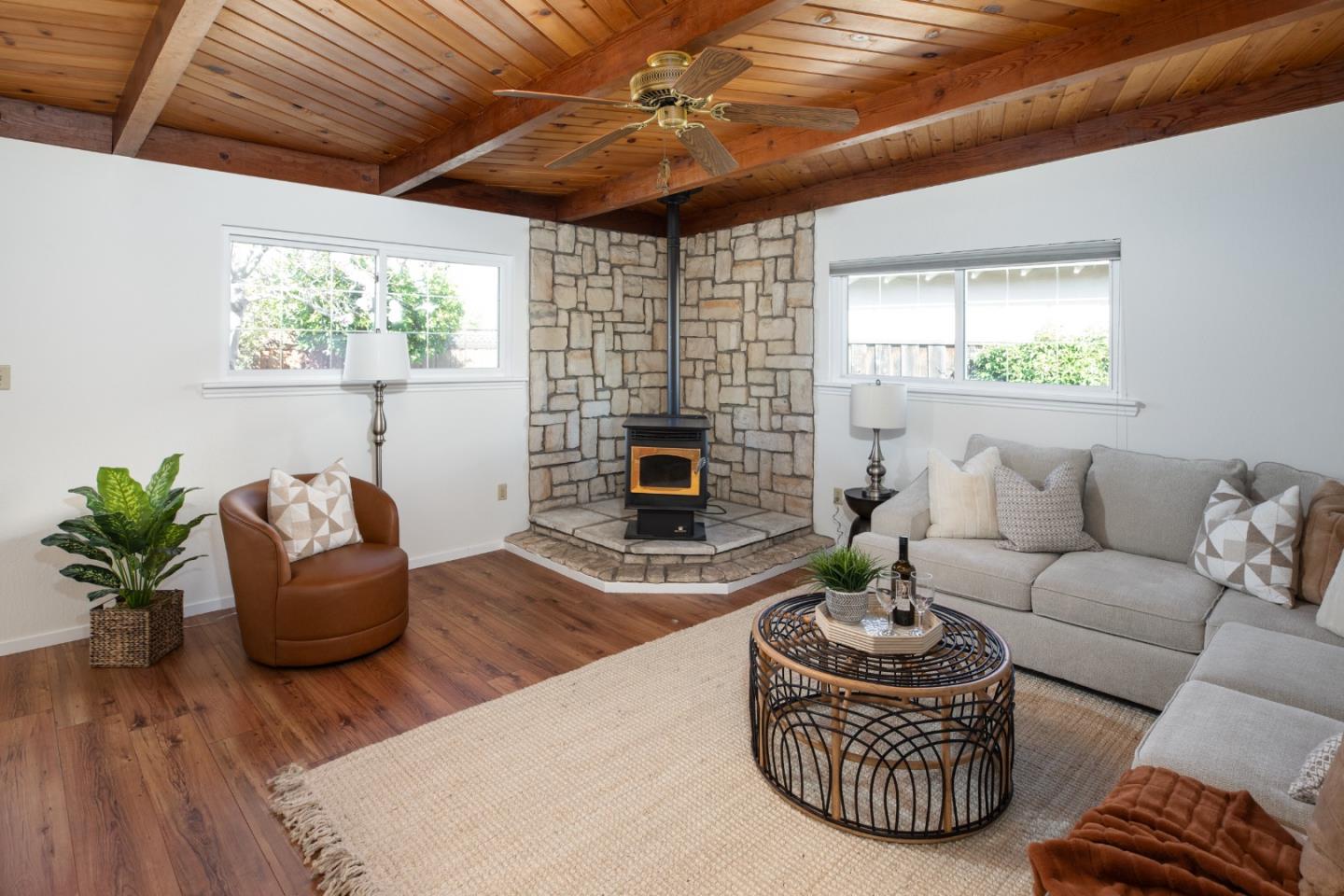 2545 Austin Place Santa Clara, CA 95050 - Photo 9 of 21 a living room with furniture a fireplace and a flat screen tv