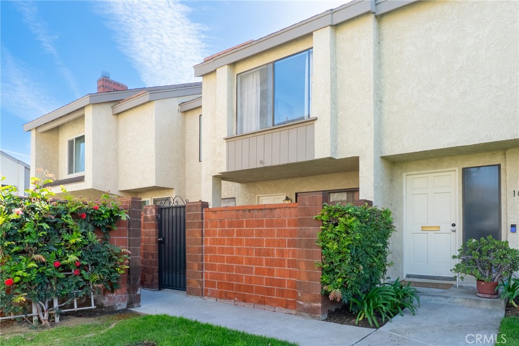1024 West Lamark Lane Anaheim, CA 92802 - Photo 1 of 34 a front view of a house with garden