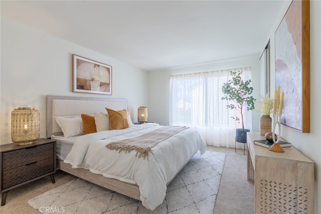 1024 West Lamark Lane Anaheim, CA 92802 - Photo 13 of 34 a bedroom with a bed table chair and a window