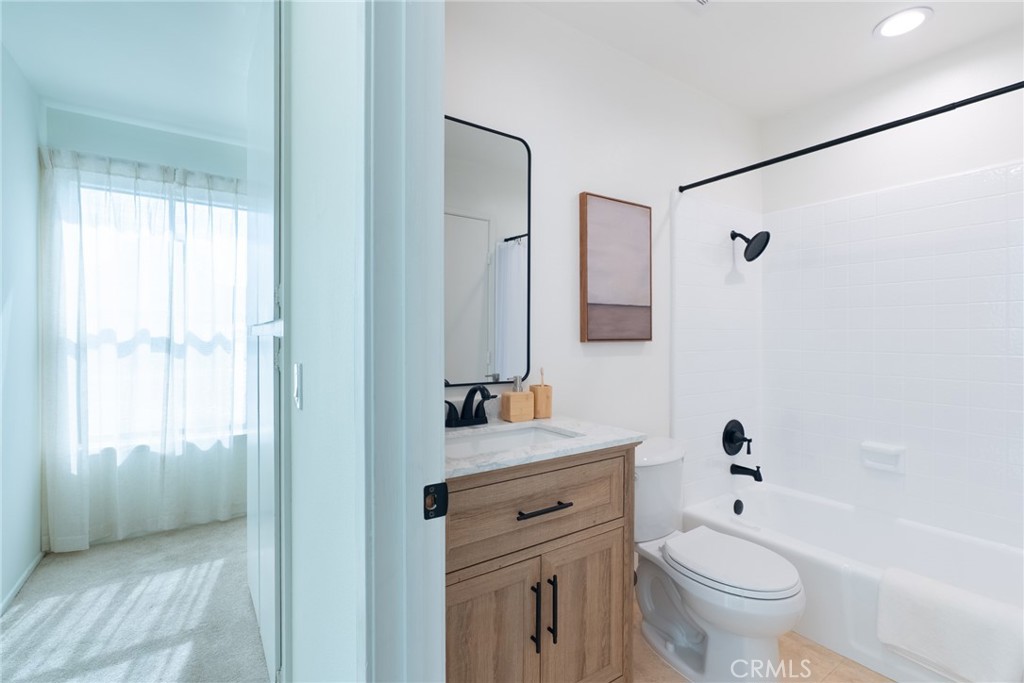 1024 West Lamark Lane Anaheim, CA 92802 - Photo 18 of 34 a bathroom with a sink a toilet and shower