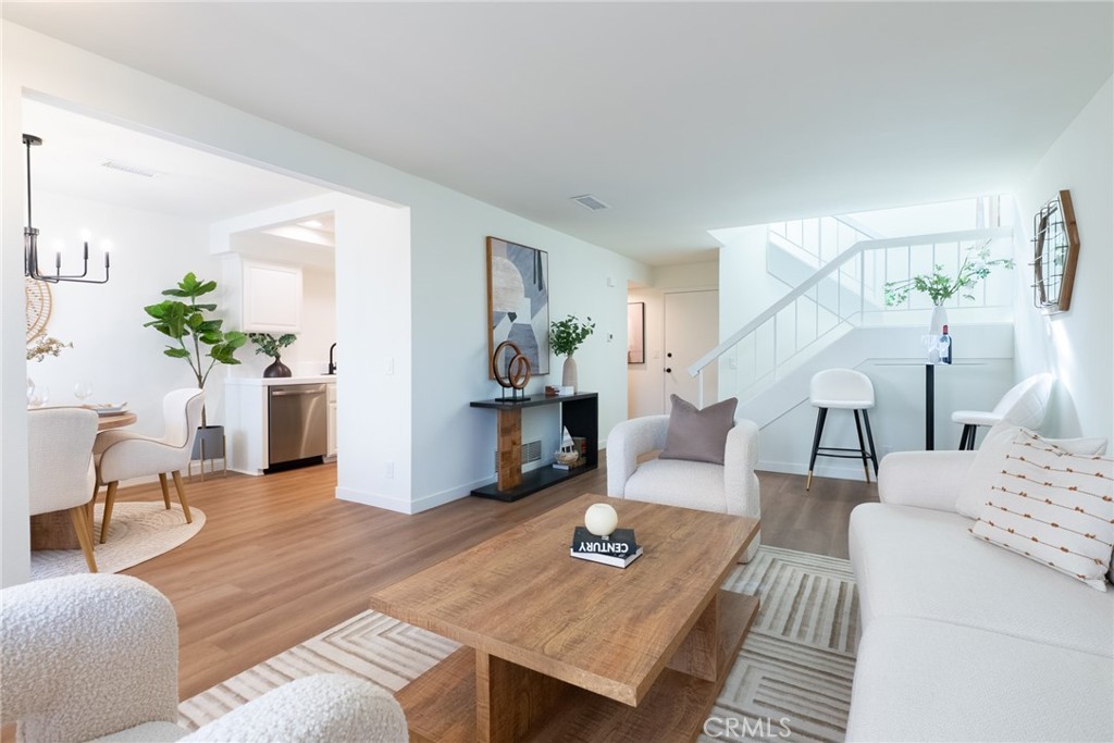 1024 West Lamark Lane Anaheim, CA 92802 - Photo 2 of 34 a living room with furniture and wooden floor