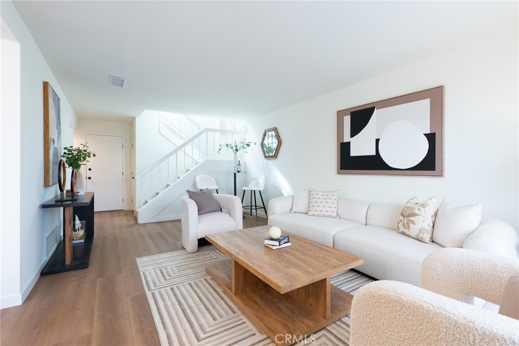 1024 West Lamark Lane Anaheim, CA 92802 - Photo 3 of 34 a living room with furniture and wooden floor