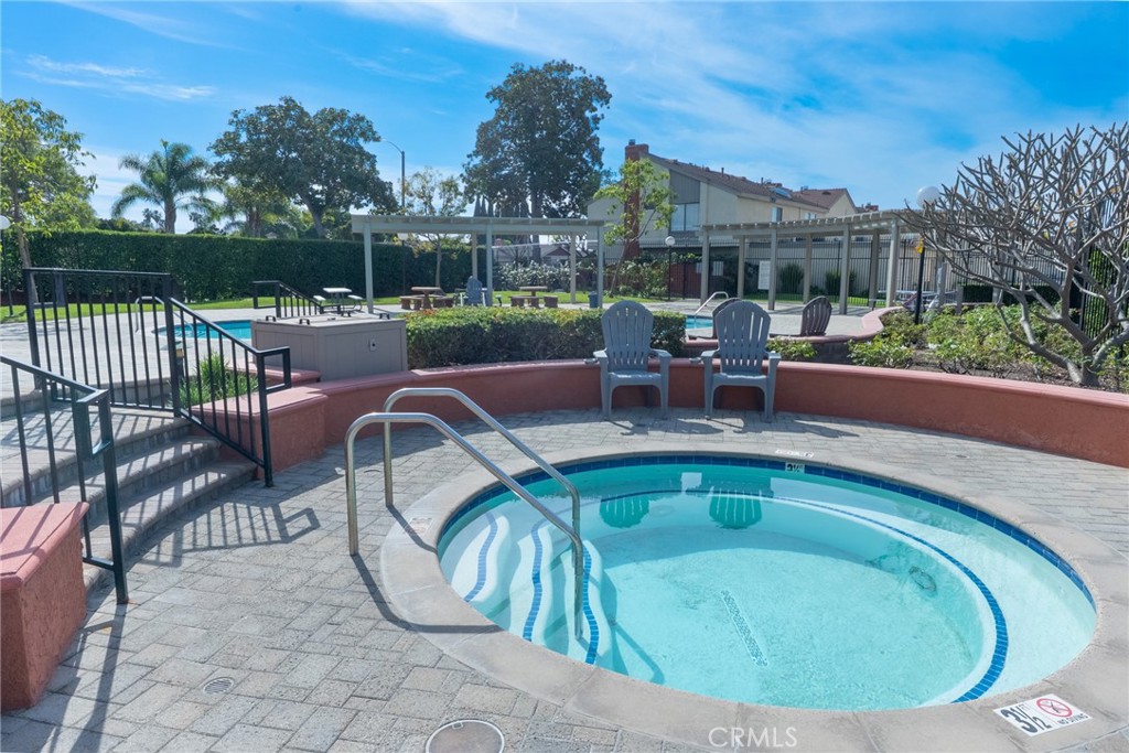 1024 West Lamark Lane Anaheim, CA 92802 - Photo 31 of 34 a view of a swimming pool with outdoor seating