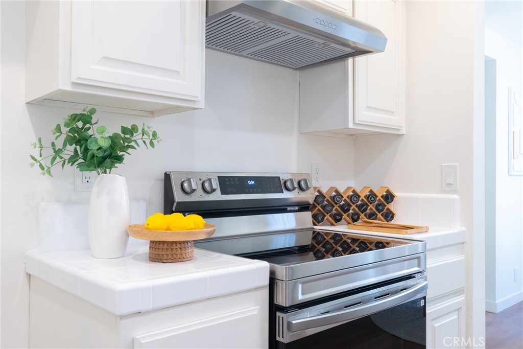1024 West Lamark Lane Anaheim, CA 92802 - Photo 6 of 34 a living room with furniture and a potted plant