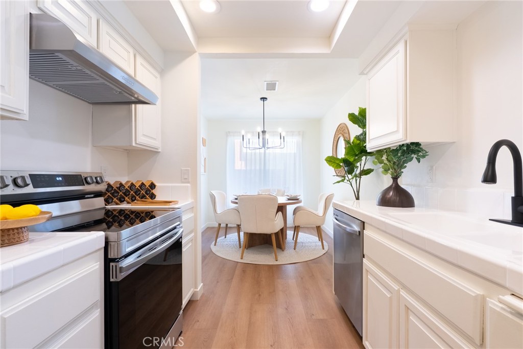 1024 West Lamark Lane Anaheim, CA 92802 - Photo 9 of 34 a kitchen with a sink appliances and cabinets