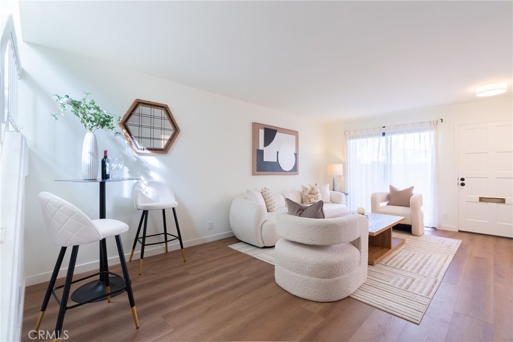 1024 West Lamark Lane Anaheim, CA 92802 - Photo 10 of 34 a living room with furniture and a wooden floor