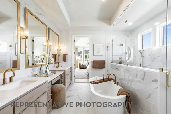 a bathroom with a tub sink and mirror