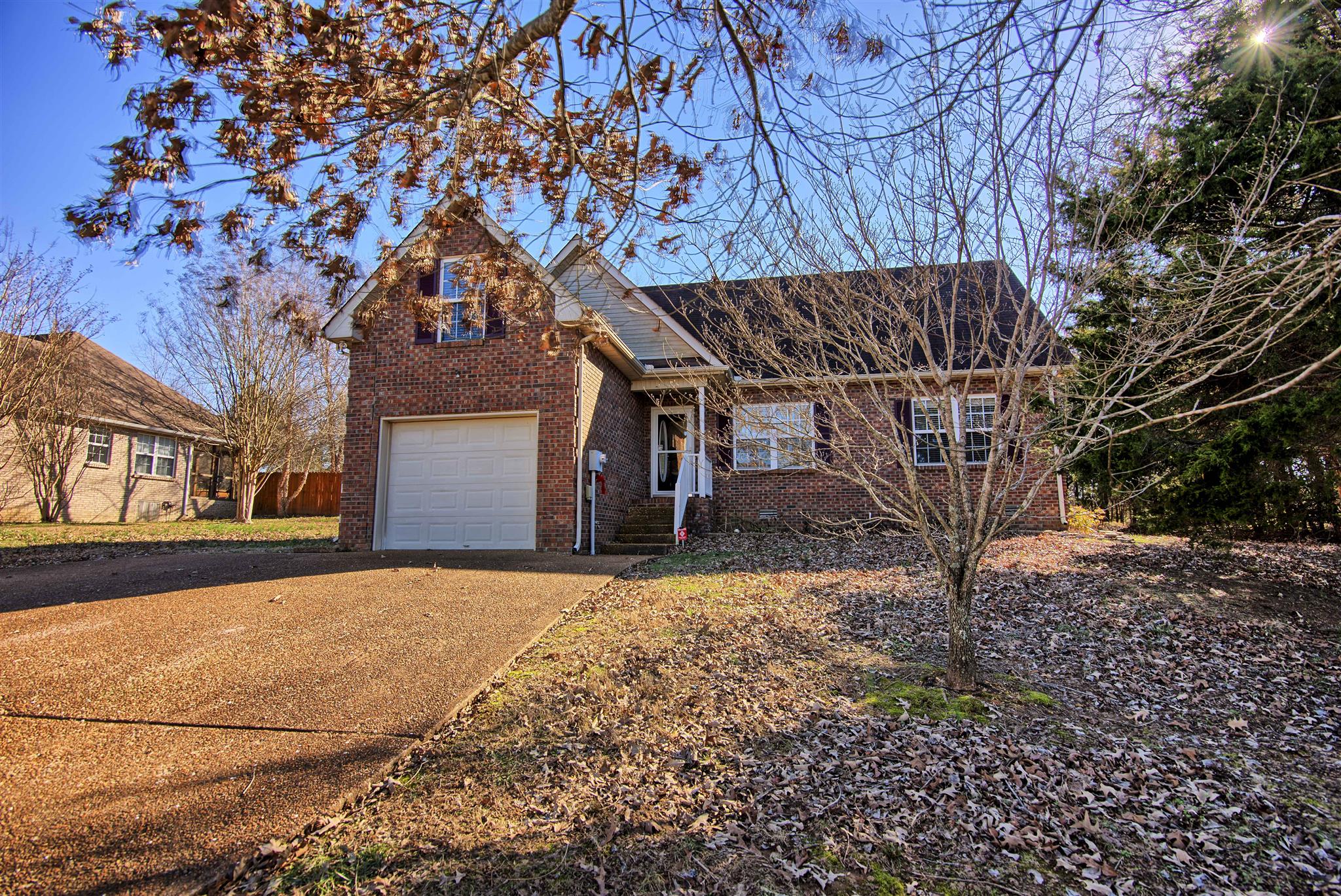 7511 Cherokee Hills Road Fairview, TN 37062 - Photo 1 of 18 a view of a house with a tree
