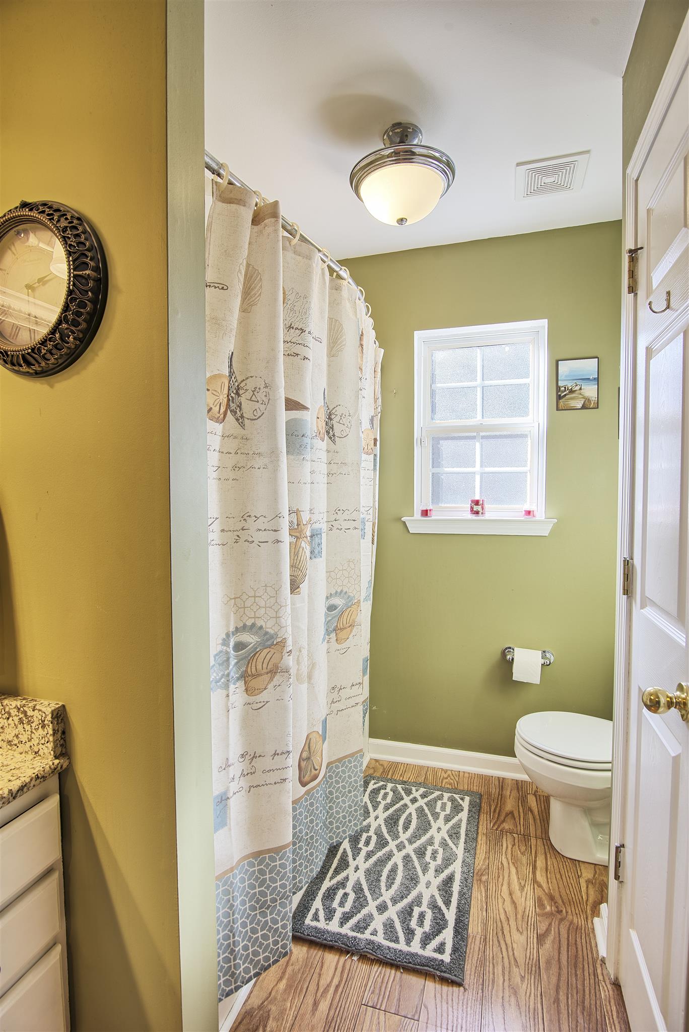 7511 Cherokee Hills Road Fairview, TN 37062 - Photo 12 of 18 a bathroom with a granite countertop sink a toilet and shower