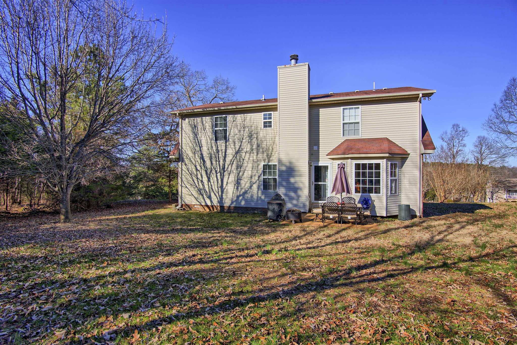 7511 Cherokee Hills Road Fairview, TN 37062 - Photo 2 of 18 a view of a house with backyard and trees
