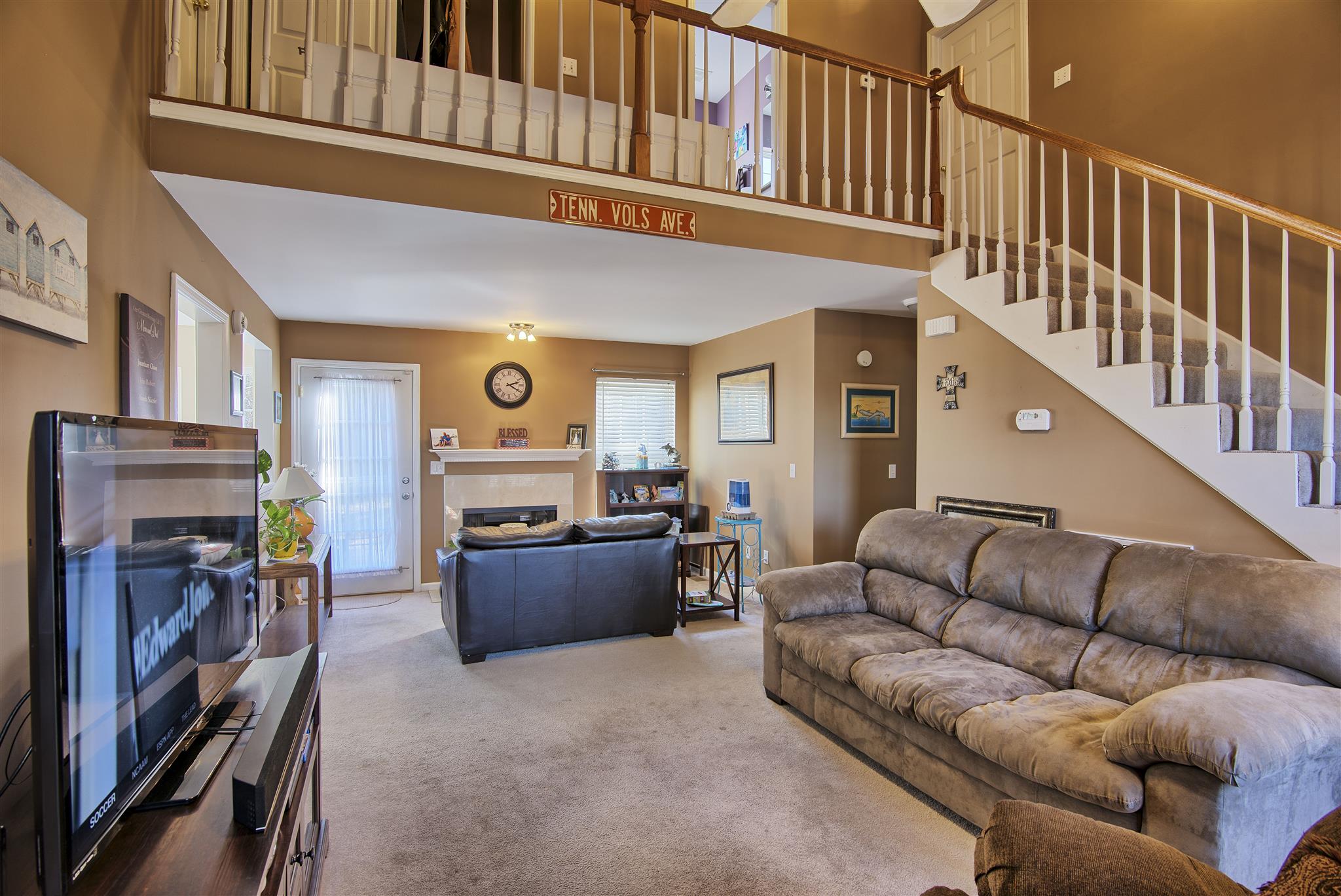7511 Cherokee Hills Road Fairview, TN 37062 - Photo 6 of 18 a living room with furniture and a flat screen tv