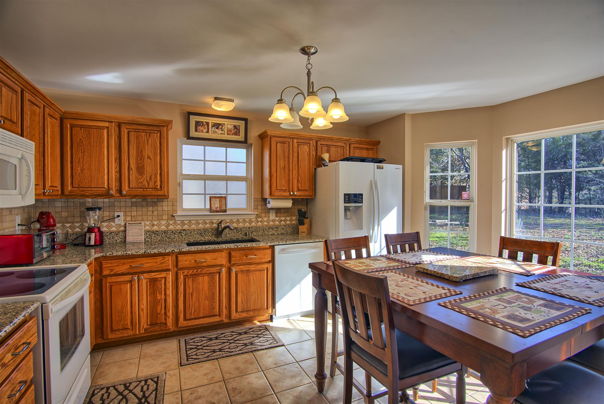 7511 Cherokee Hills Road Fairview, TN 37062 - Photo 8 of 18 a kitchen with granite countertop lots of counter top space and dining table