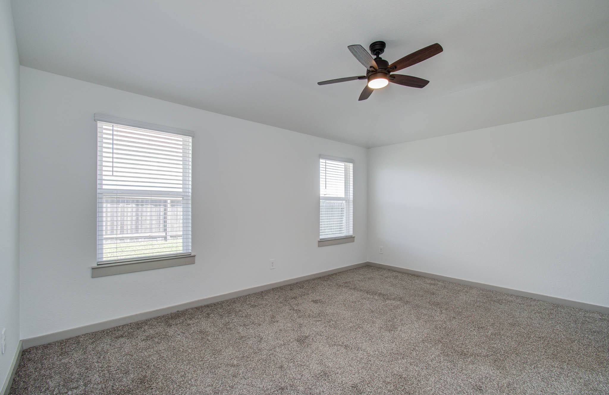 14543 Raintree Drive Baytown, TX 77523 - Photo 25 of 37 Primary suite with view of the backyard.