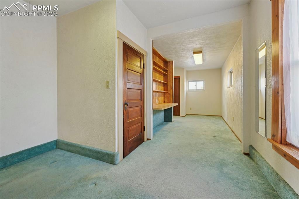 109 Second Street Ramah, CO 80832 - Photo 16 of 39 an empty room with closet and mirrors