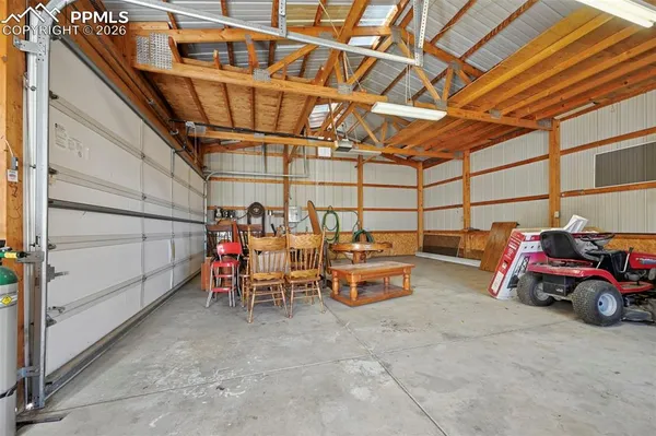 a view of a garage with cars