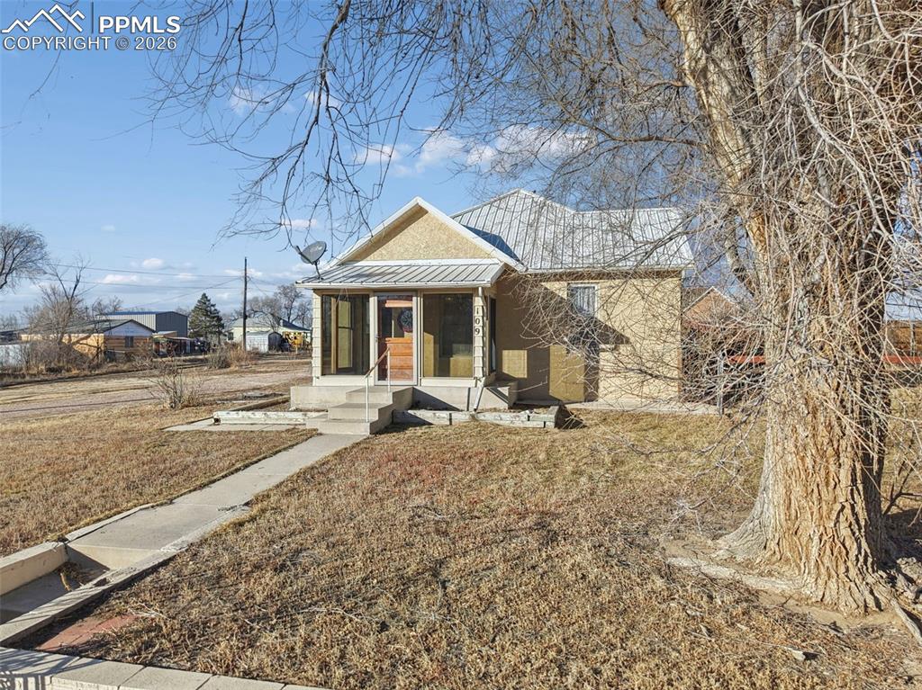 109 Second Street Ramah, CO 80832 - Photo 5 of 39 a front view of a house with garden