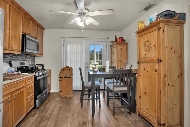 a view of a dining room with furniture window and wooden floor