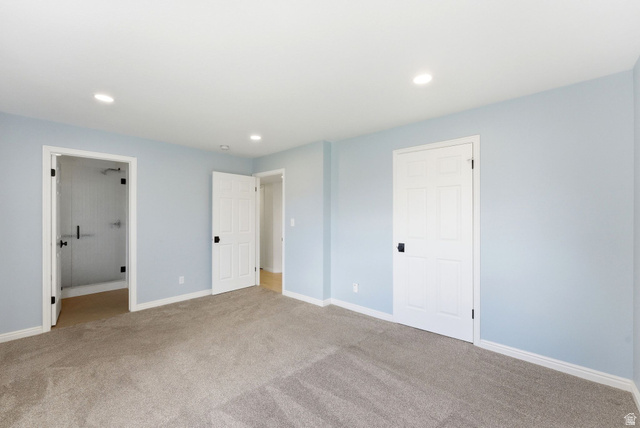 1041 West Grindelwald Court, Unit R5 Midway, UT 84049 - Photo 17 of 44 Swiss Oaks primary bedroom with carpet flooring, closet storage, and bright window exposure