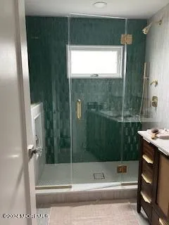 a bathroom with a bathtub and a shower
