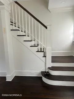a view of entryway with wooden floor