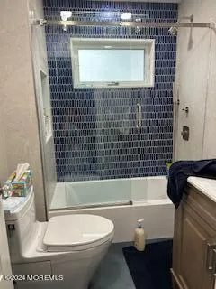 a bathroom with a toilet a sink and bathtub