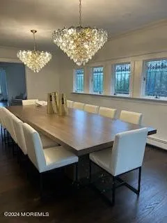 a view of a dining room with furniture and chandelier
