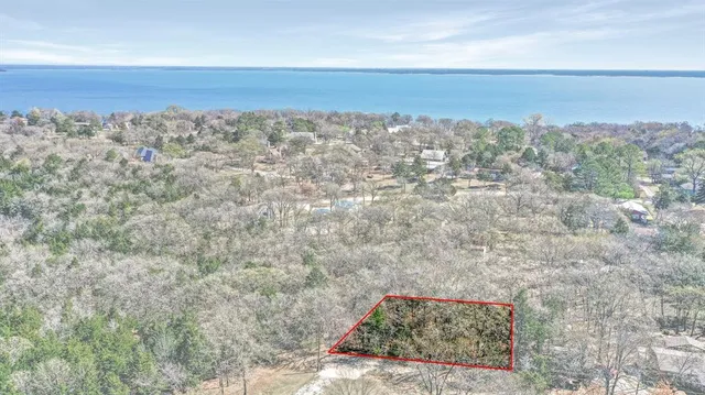 a view of a large building with mountains in the background