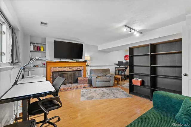 a view of a livingroom with furniture and a flat screen tv