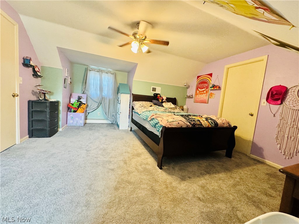 9531 West Ridge Road Elyria, OH 44035 - Photo 21 of 32 Bedroom with carpet, ceiling fan, and vaulted ceiling