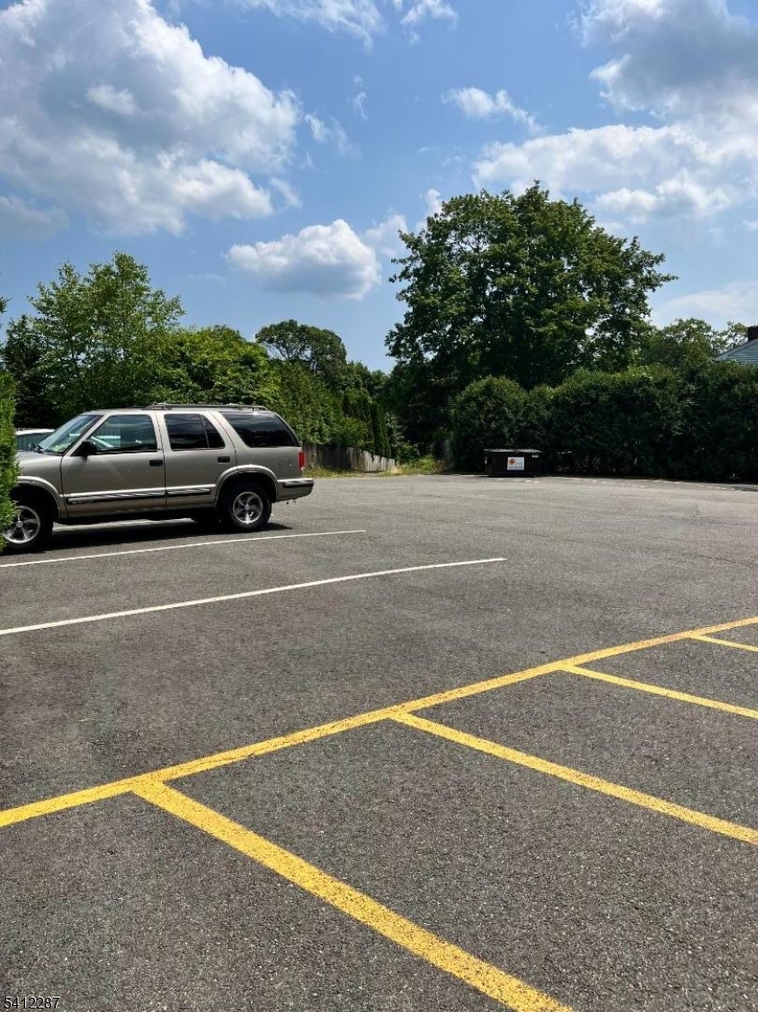 16 Woodland Avenue, Unit 4 Butler, NJ 07405 - Photo 17 of 19 a view of a tennis court