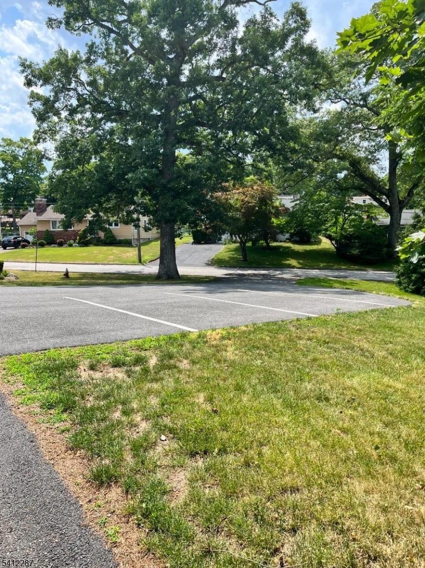 16 Woodland Avenue, Unit 4 Butler, NJ 07405 - Photo 18 of 19 a view of a swimming pool and a yard