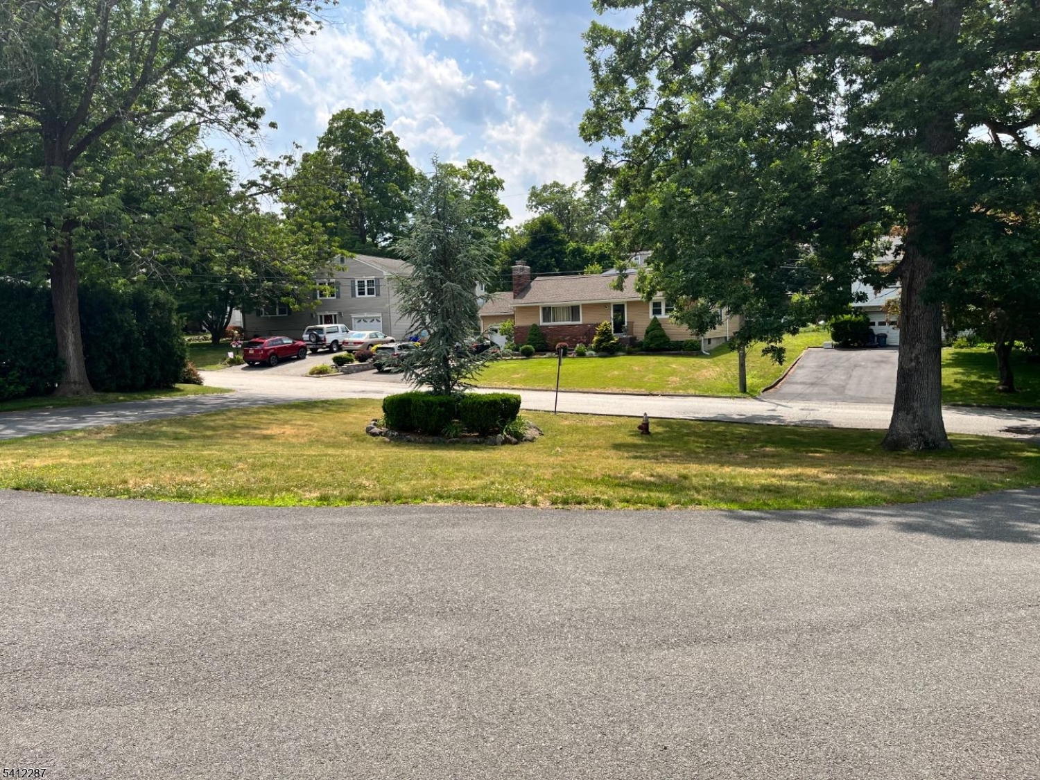 16 Woodland Avenue, Unit 4 Butler, NJ 07405 - Photo 19 of 19 a view of a swimming pool with a garden and trees