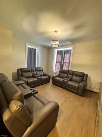 a living room with furniture and a lamp