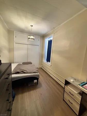a room with pool table and windows